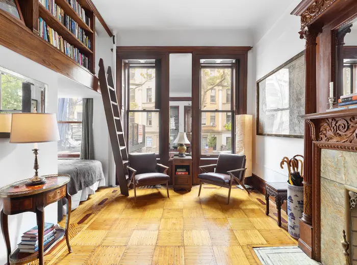 Cozy up by the fireplace in this $559K Upper West Side brownstone studio