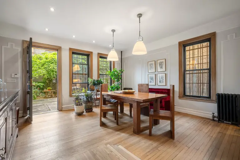 For $2.5M, this compact Harlem carriage house has a backyard, garage, and room to expand
