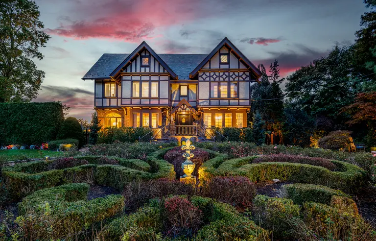 A tennis court and a boxwood maze surround this $2.7M 1913 Tudor home on Long Island
